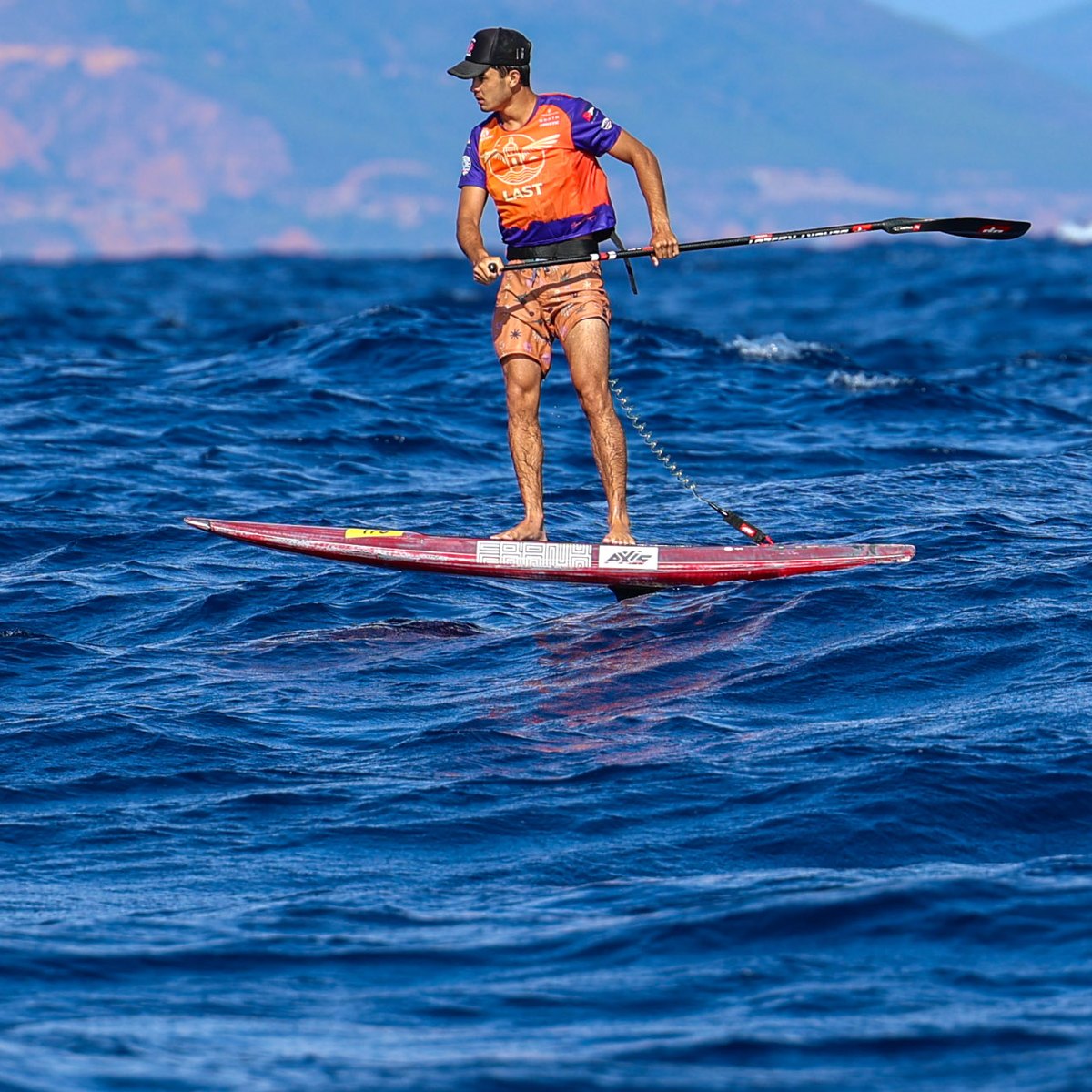 Downwind foil racing at Les Ailes de Saint-Tropez on an AXIS + FRANK board, the Esterel behind
